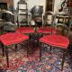 Set of four Napoleon III chairs in black lacquered wood with gold highlights.
