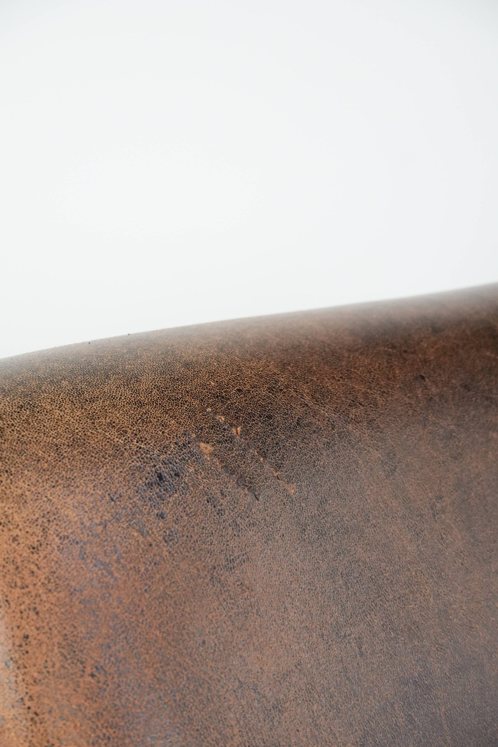 Set of two vintage sheepskin leather design armchairs in a cognac colour