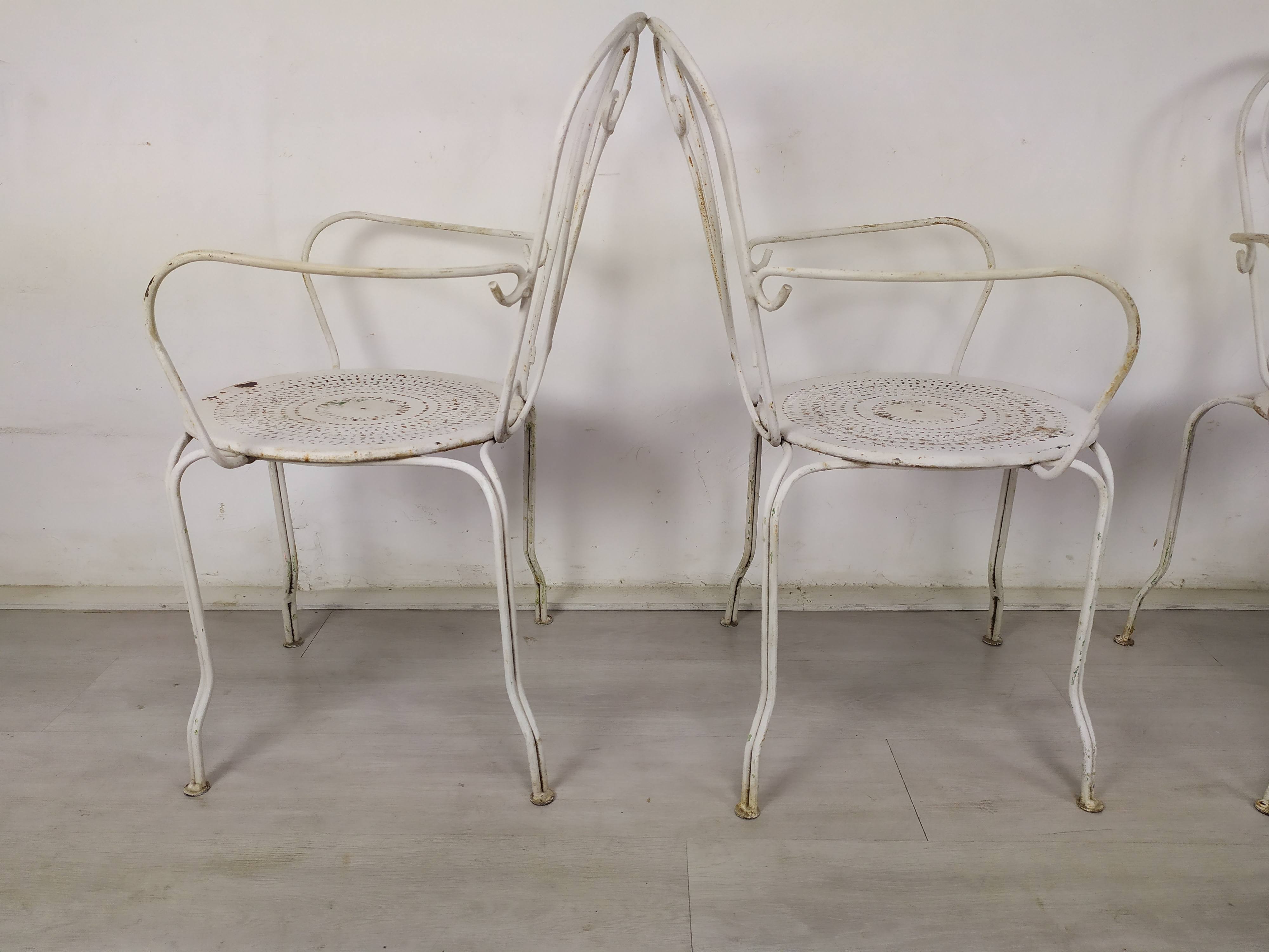 4 wrought iron garden armchairs