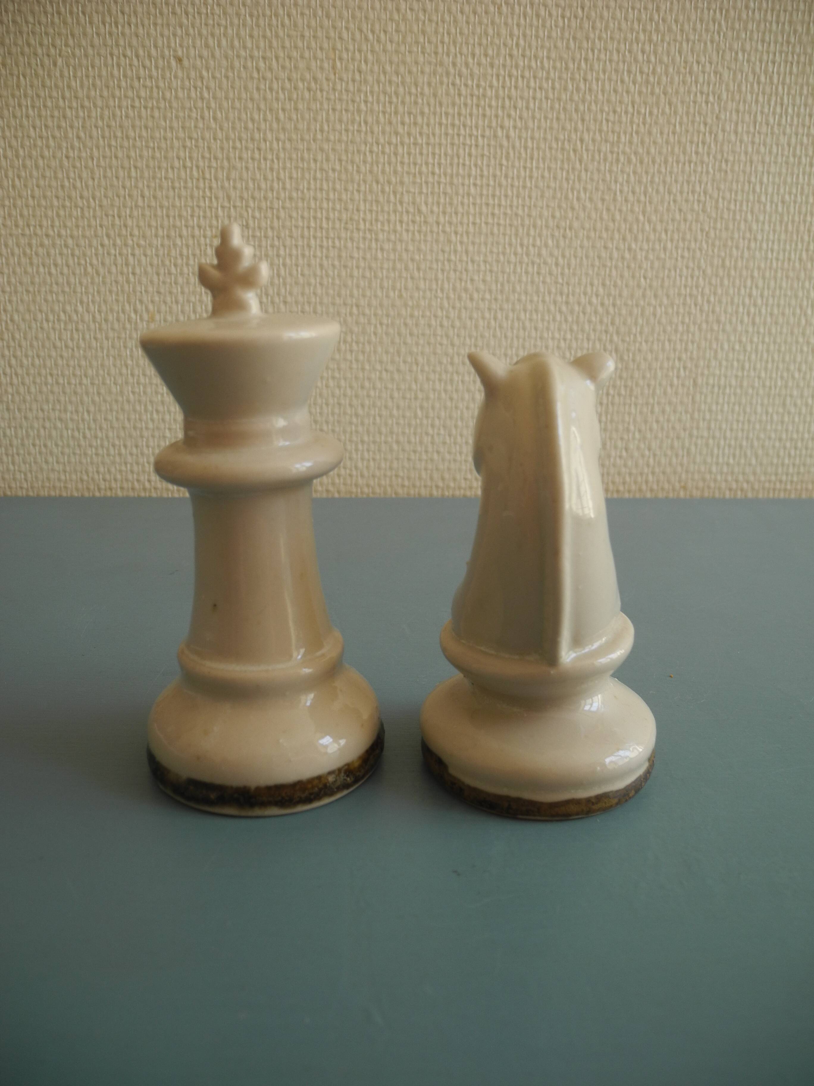 two ceramic chess pieces decorative