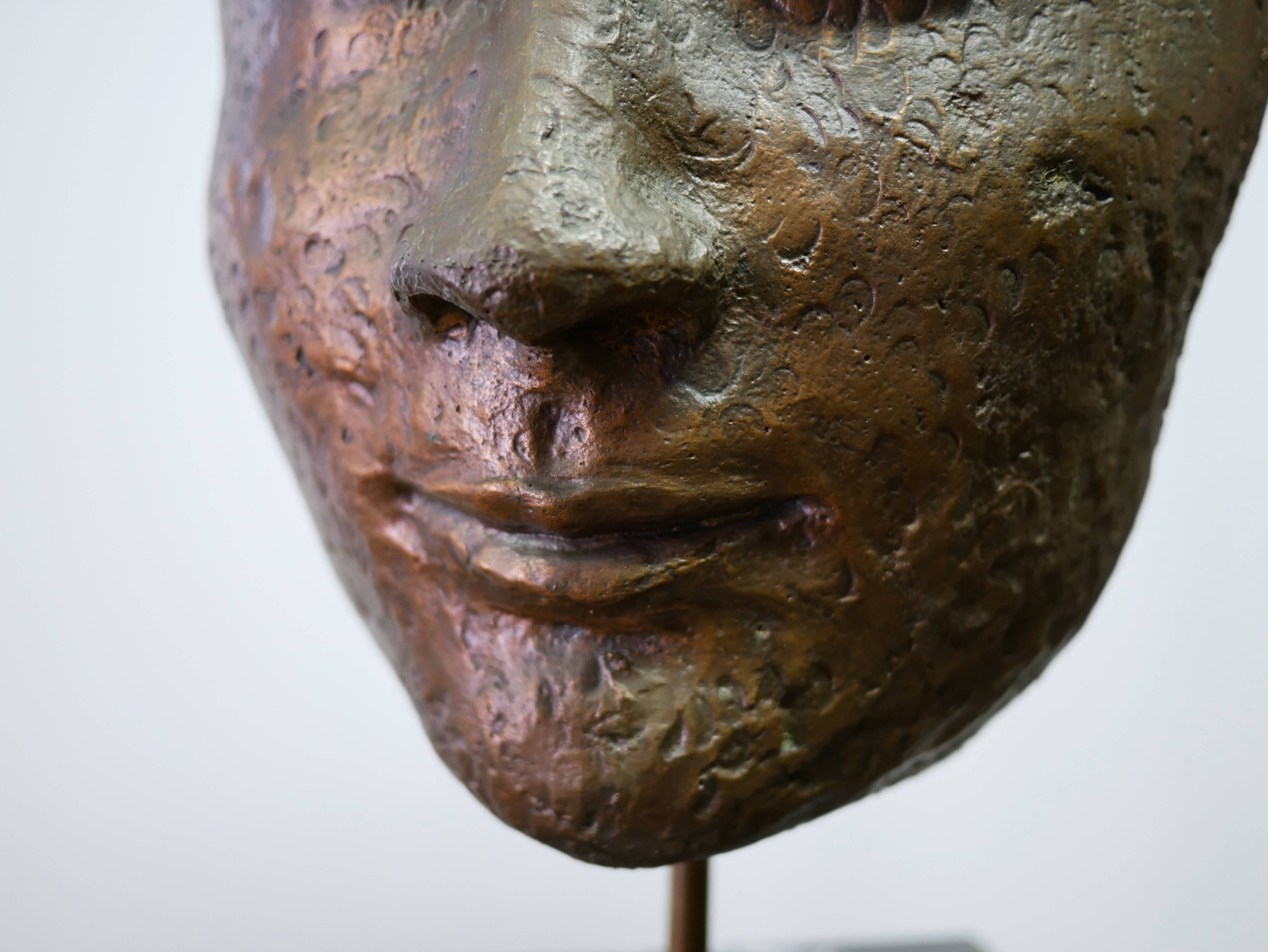 Buddha head sculpture, marble base