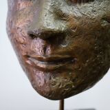 Buddha head sculpture, marble base