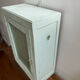 Old medicine cabinet in mint green patinated wood