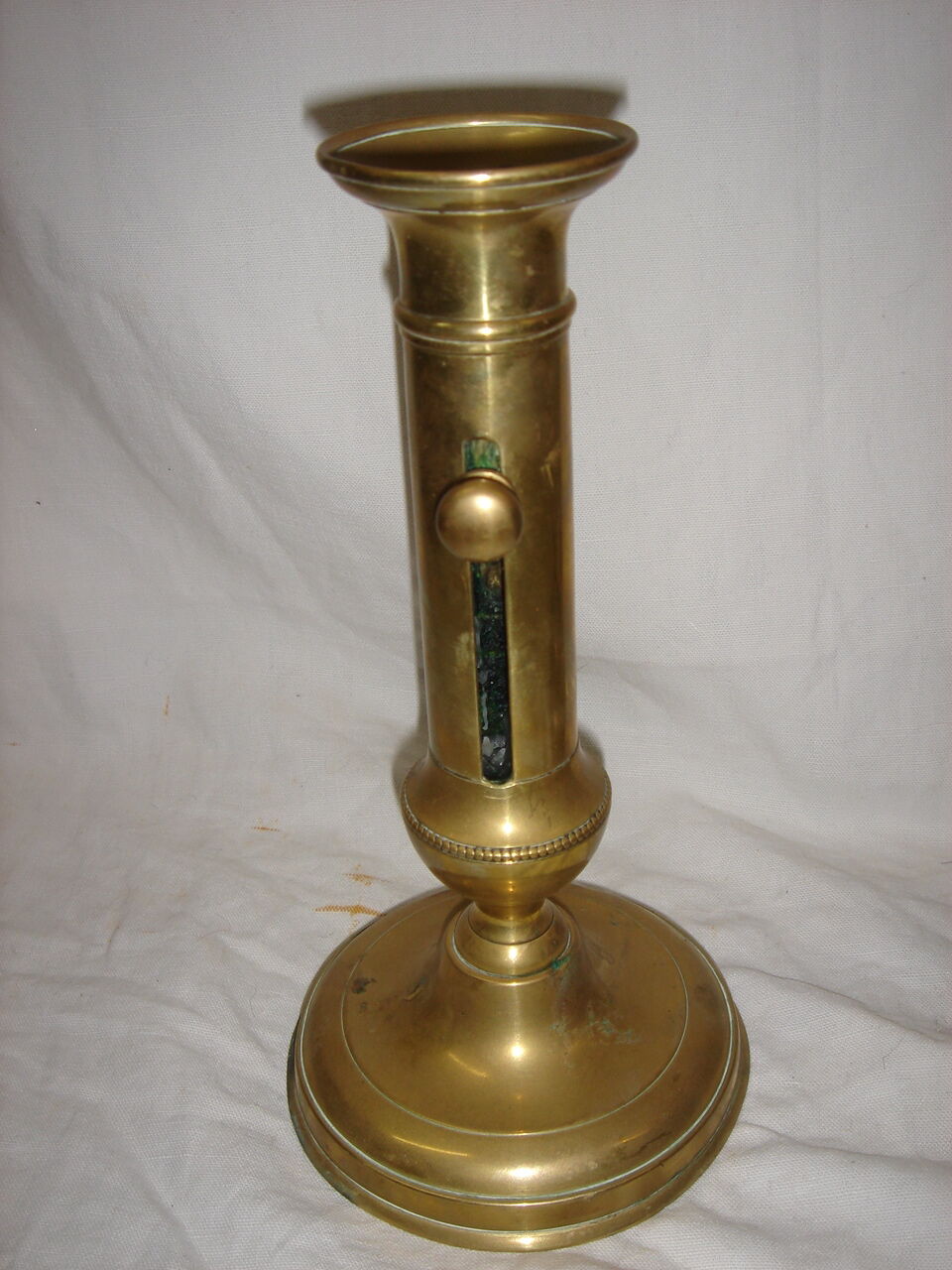 Pair of brass push-up candlesticks, 1940