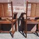 Pair of oak armchairs with straw seats and backs.