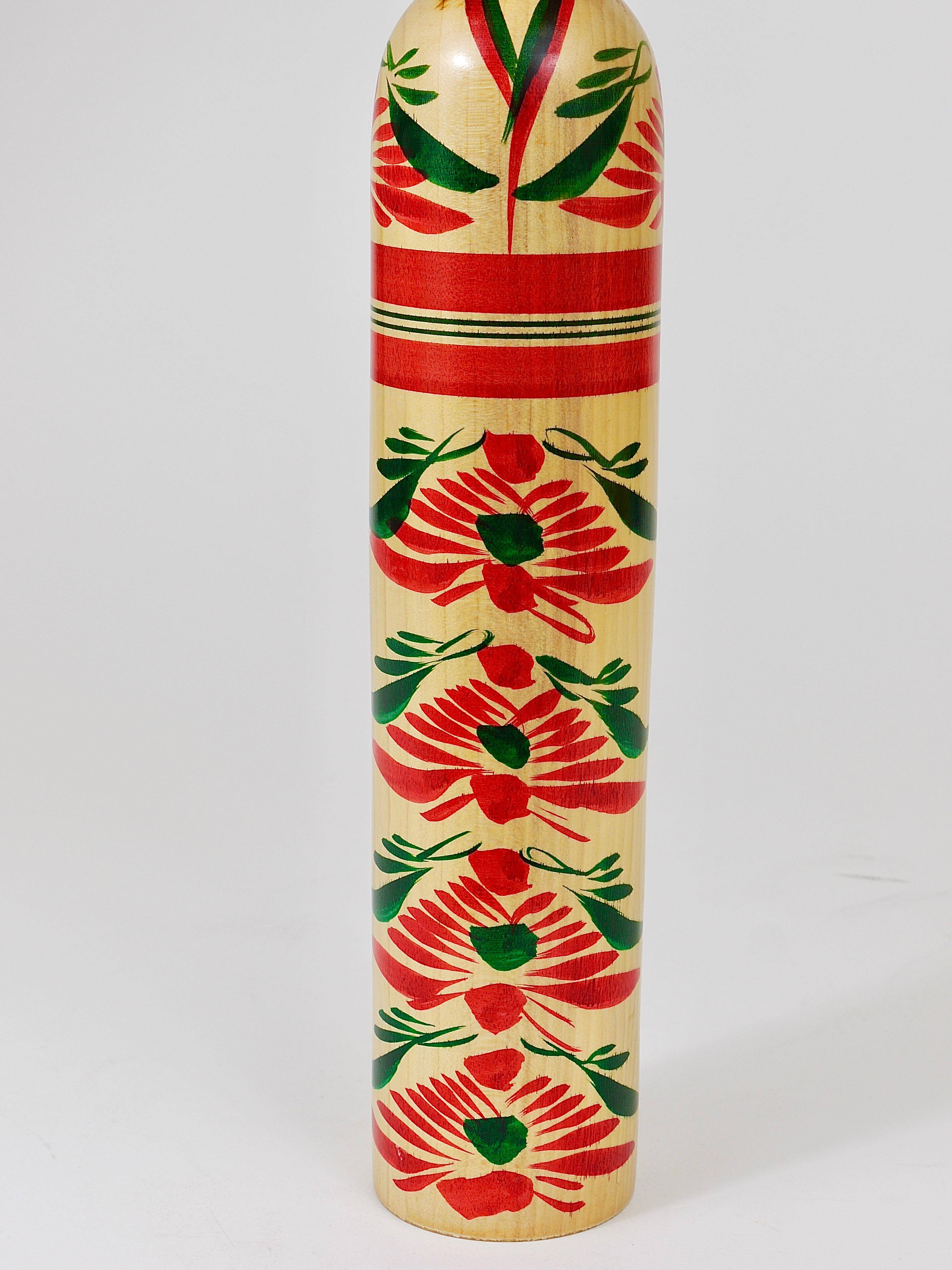 Decorative Kokeshi doll sculpture from northern Japan, hand-painted, signed.