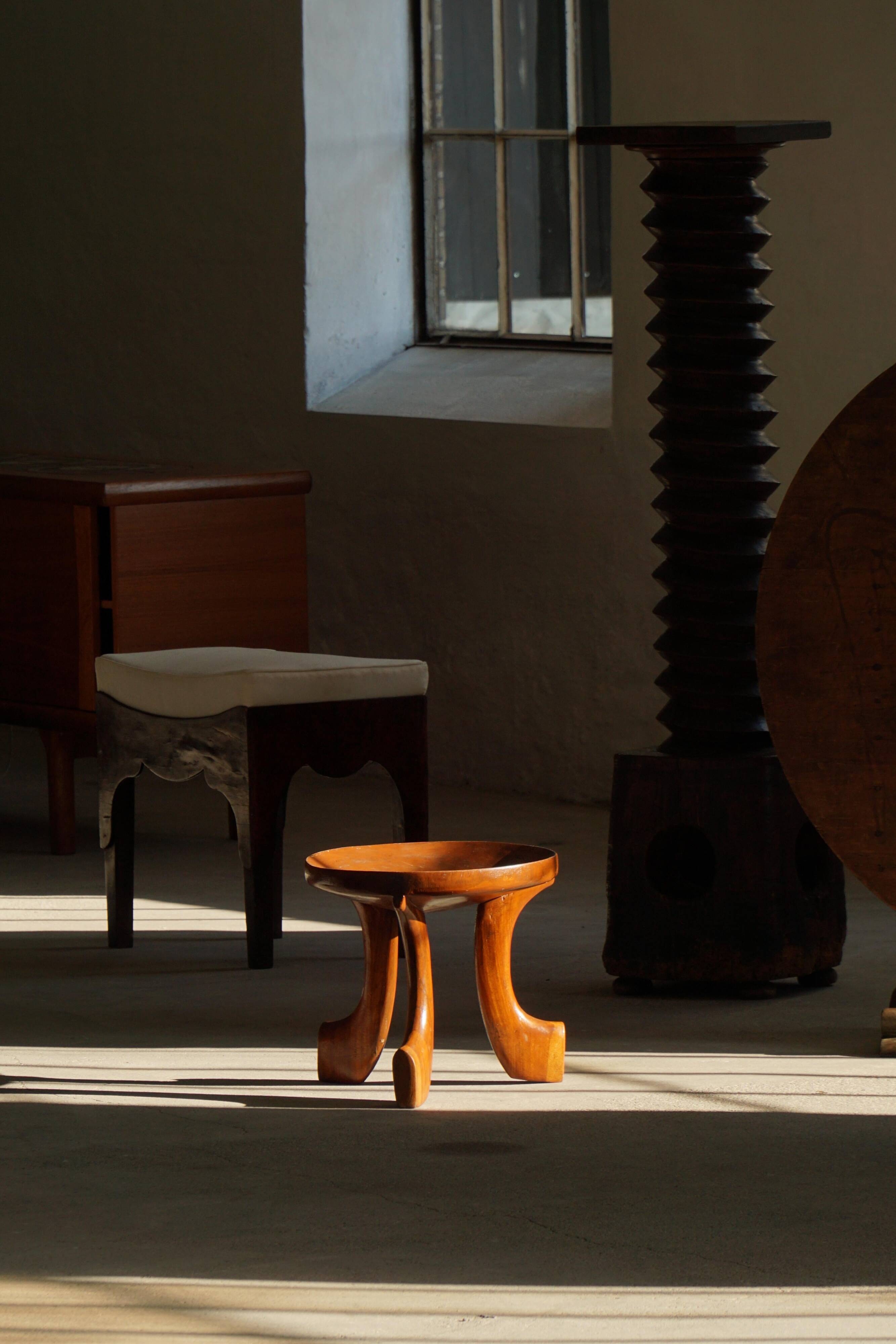 Oromo stool from mid-20th century Africa, hand-carved wood, tribal style.
