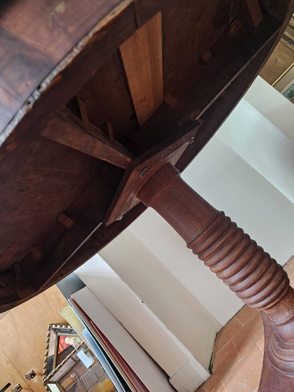 Round table with central tripod leg