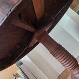 Round table with central tripod leg