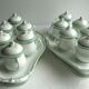 Porcelain cream service of Paris 1850, 6 pots on green and gold oval tray