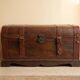 Wooden trunk with leather and metal, ultra chic and elegant in a living room or bedroom.