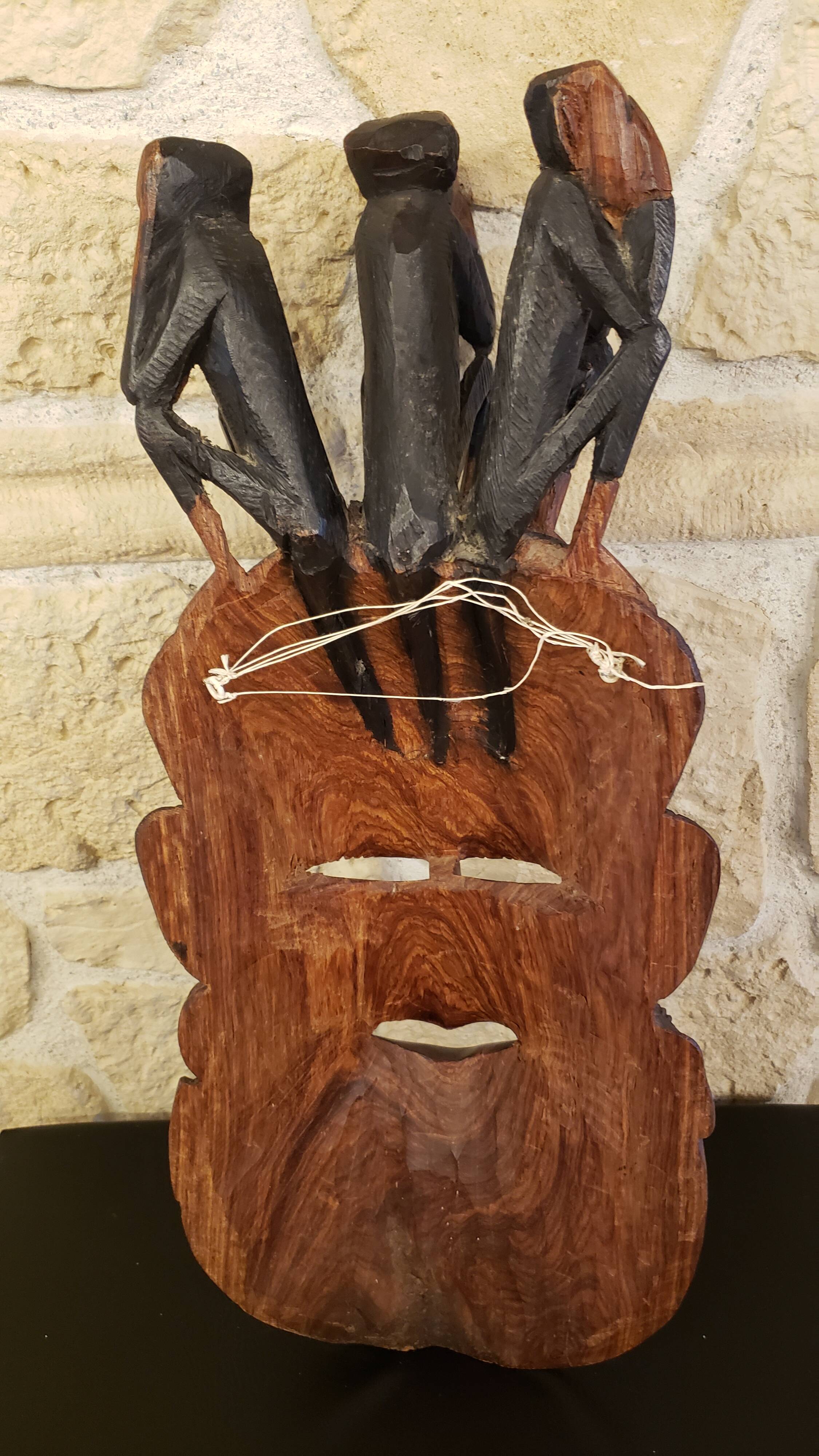Old large African wall mask in carved wood