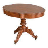 Antique carved wooden table – scalloped top and castors