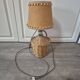 vintage table lamp dame jeanne covered in rattan wicker with a handle
