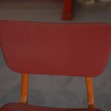 Set of 4 designer chairs in oak and red leatherette from the 1960s
