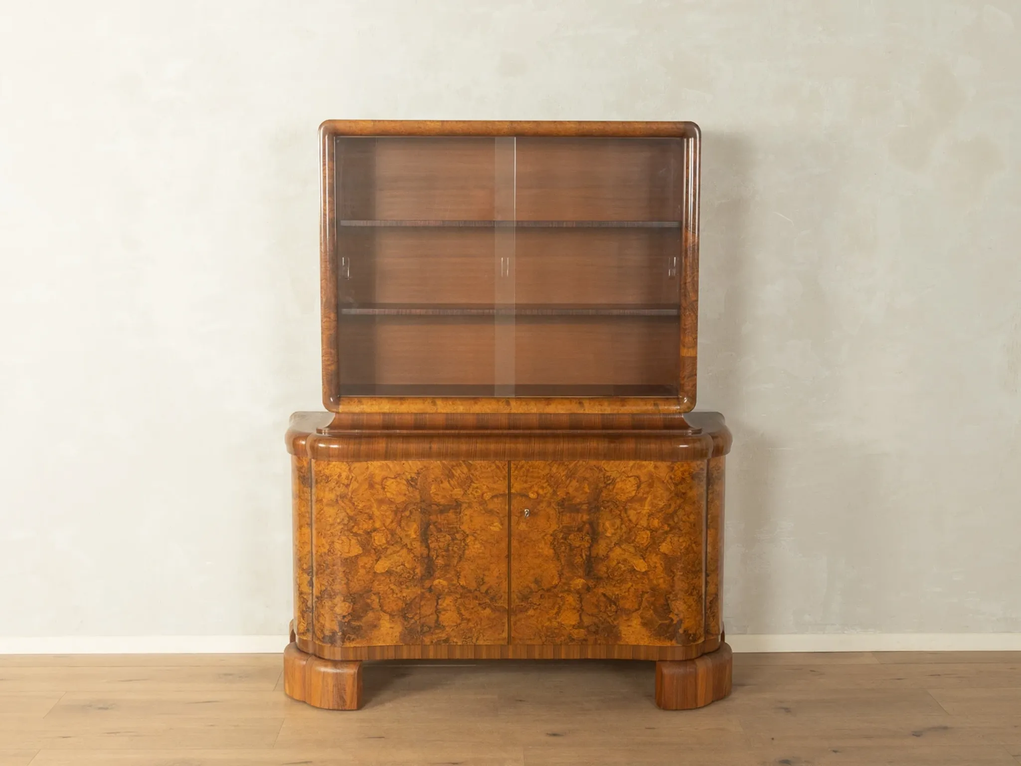 Classic two-piece Art Deco display cabinet from the 1930s with striking burl wood veneer
