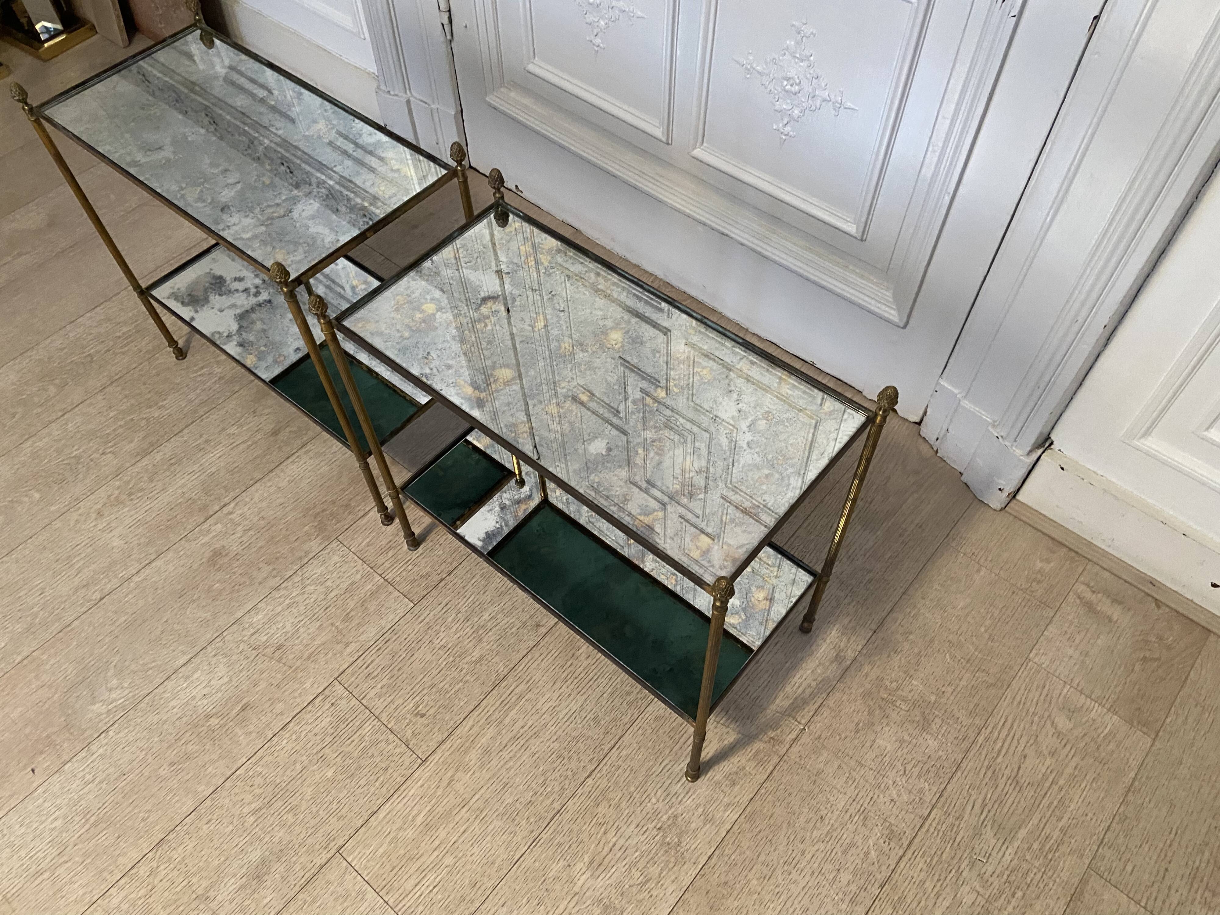 Pair of neo classic brass side tables and oxidized mirror