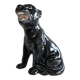 Statue of a roaring panther/leopard sitting in black glazed ceramic.