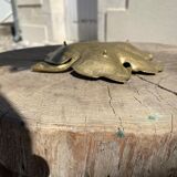 Empty brass leaf pocket