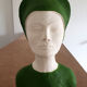 Bust of a woman in green and white plaster