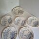 Set of 6 flat plates plus one earthenware dish.