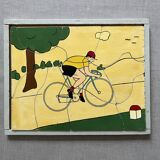 Cadre puzzle en bois des années 30/40 représentant un cycliste