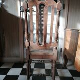 Chair with a decoration of foliage and bunches of grapes