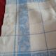 White and sky blue damask tablecloth and 10 towels