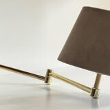 articulated brass and velvet wall light