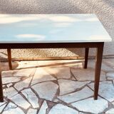 Vintage oak farmhouse table with a white top.