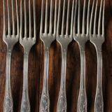 A set of 6 old flowered metal forks
