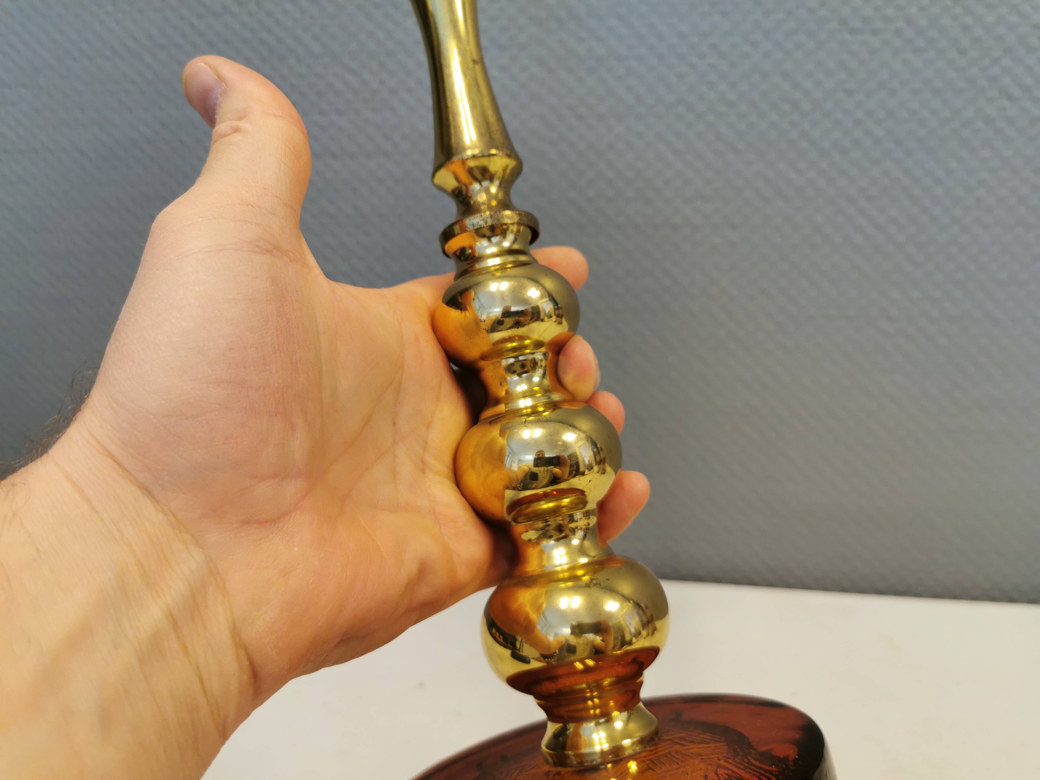 Table lamp from Danish Vitrika in brass, amber colored hard pressed glass, with a shade holder.