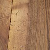 Round drop-leaf table made entirely of solid walnut