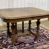 Henri II walnut table from the early 20th century with extensions.