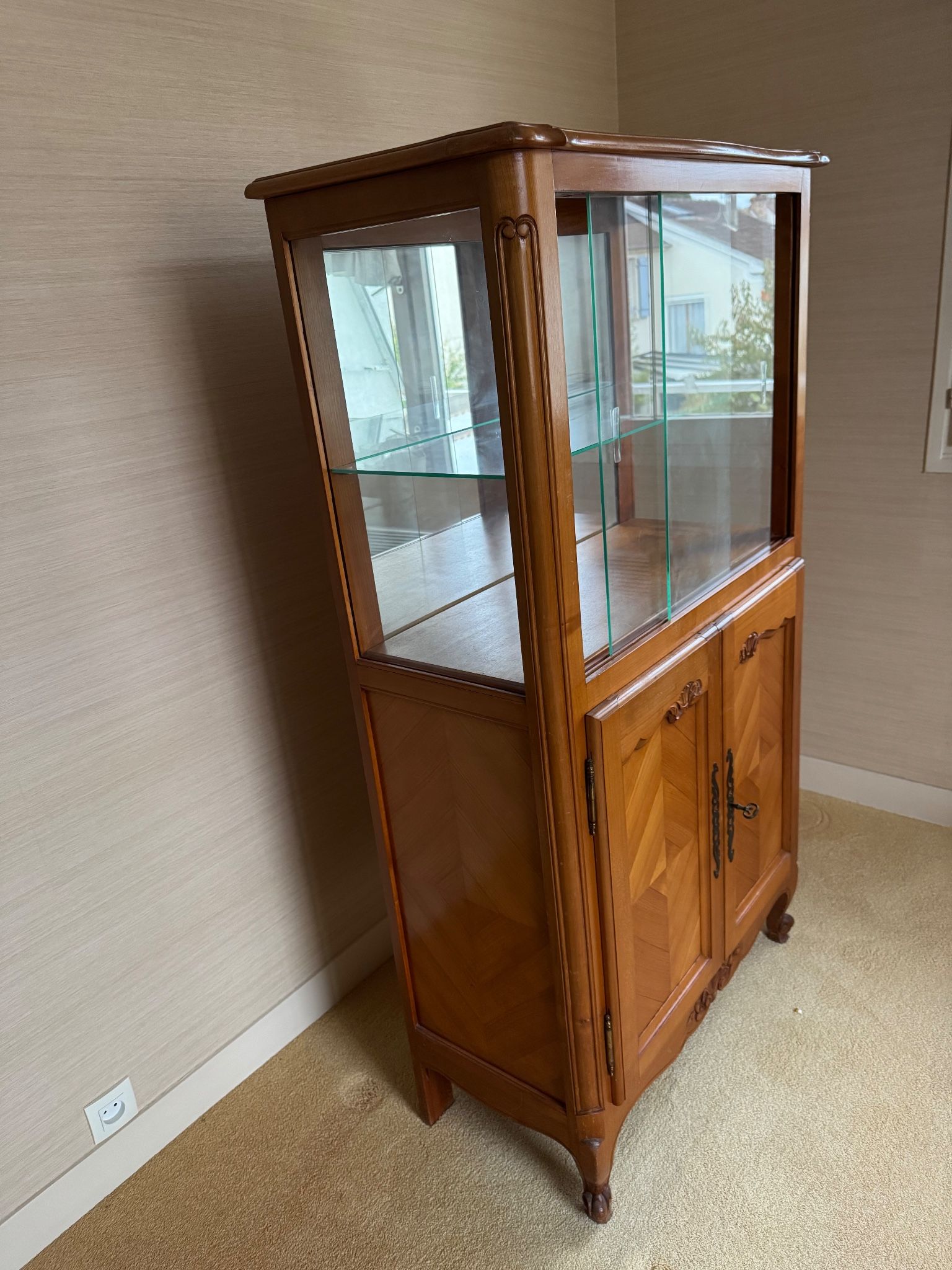 Louis XV style display cabinet, glass doors and chevron panels.