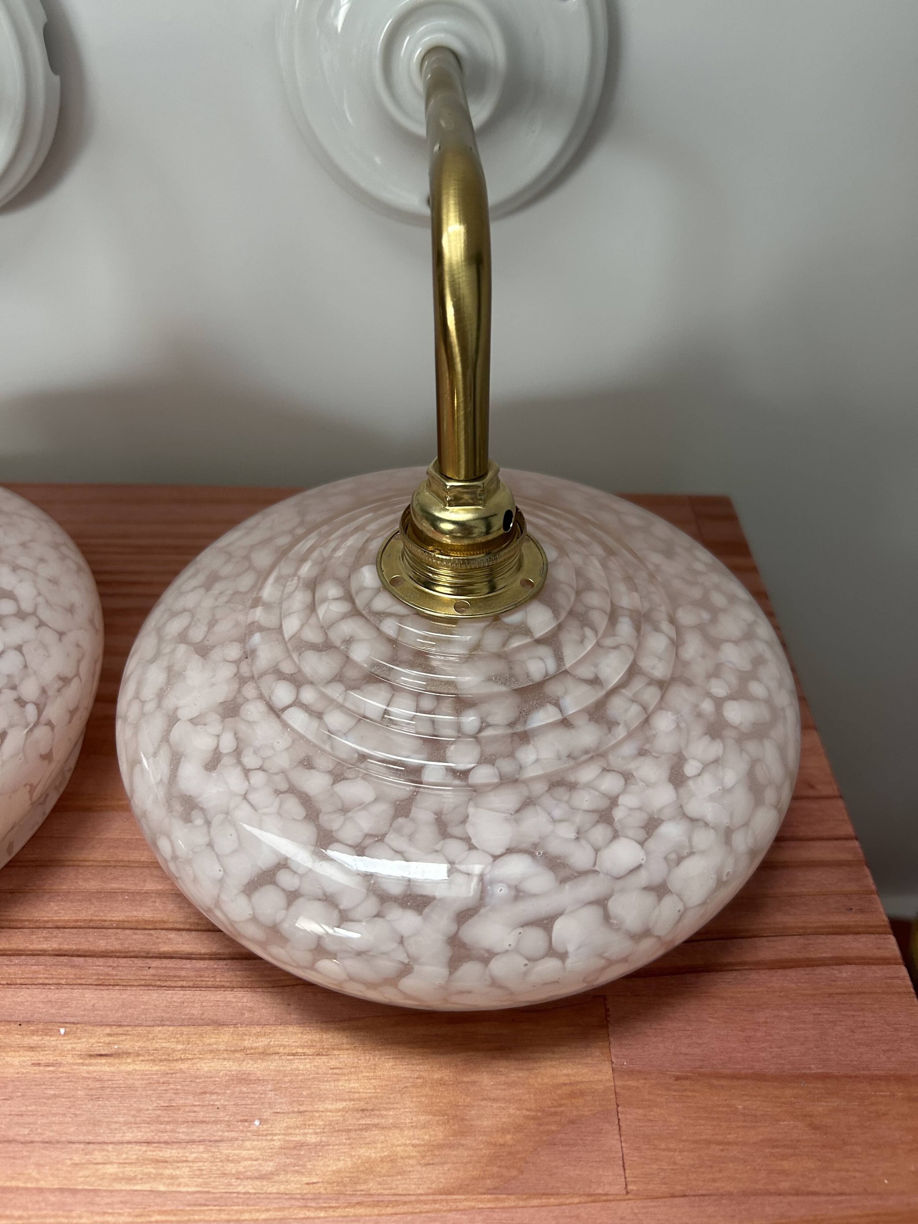 Pair of pink globe wall lights