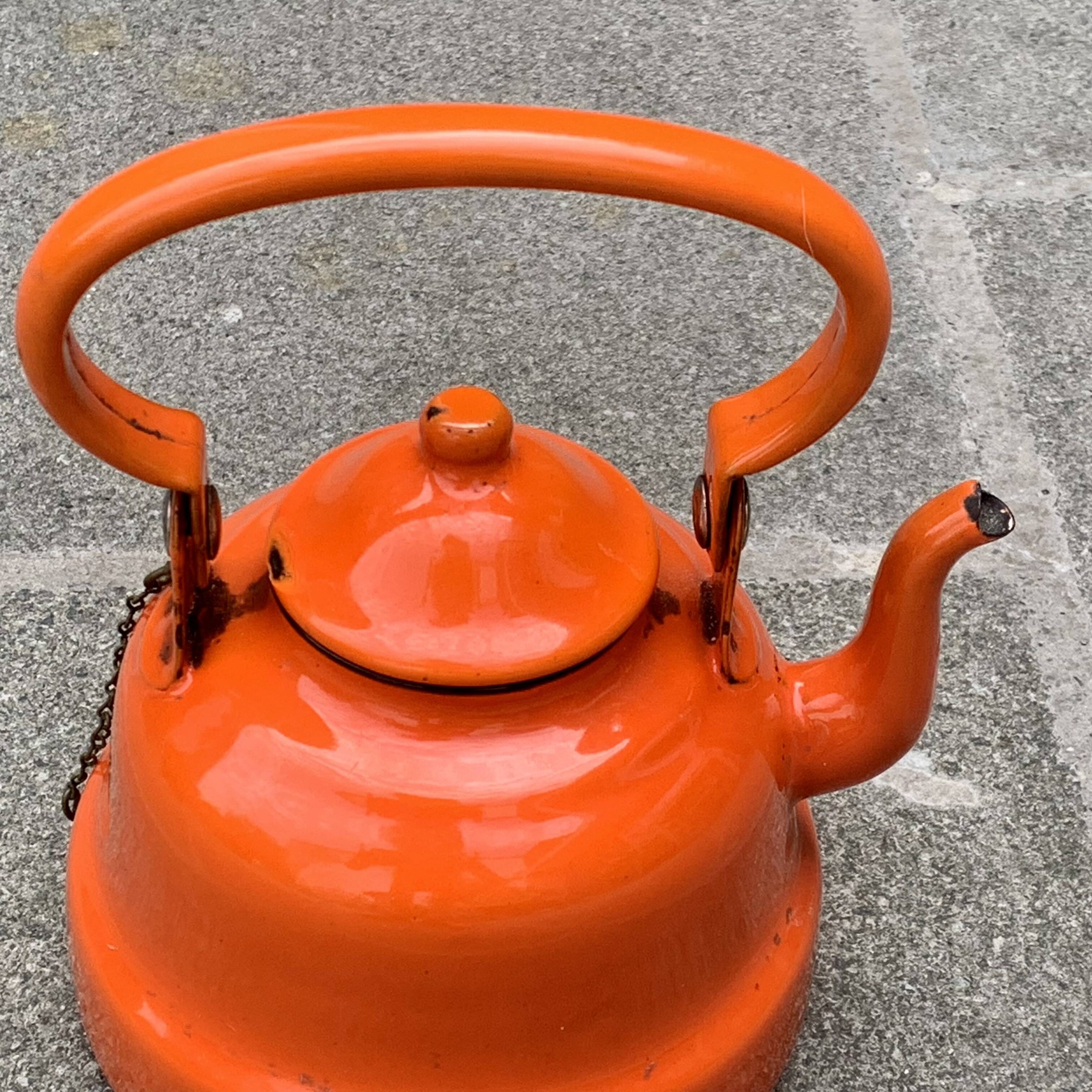 Vintage orange enameled sheet metal kettle