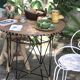 Vintage round table in woven rattan and black wrought iron – 1950s / 1960s