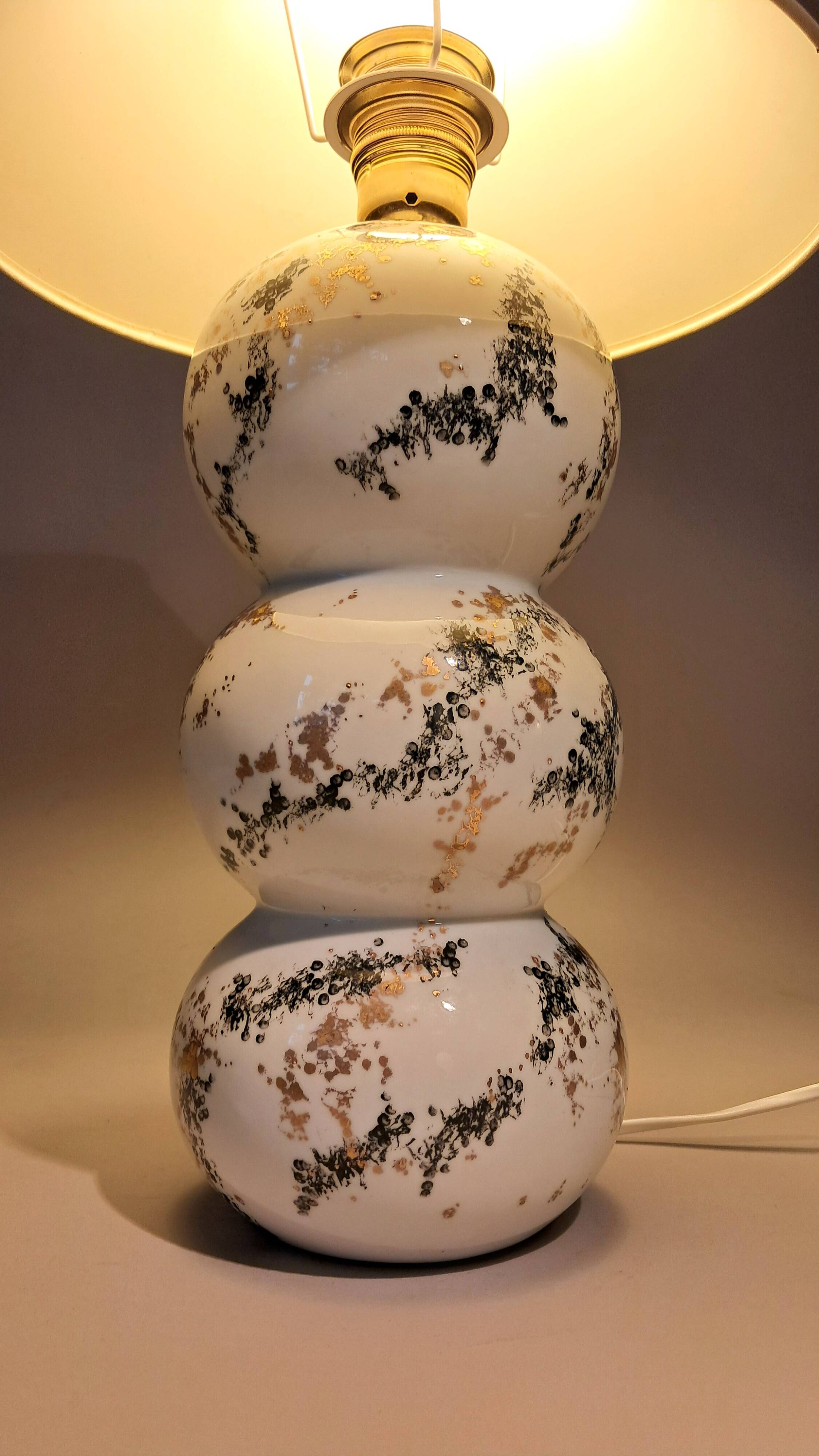 Fine porcelain lamp painted and gilded with fine gold. Laure Selignac, Paris.