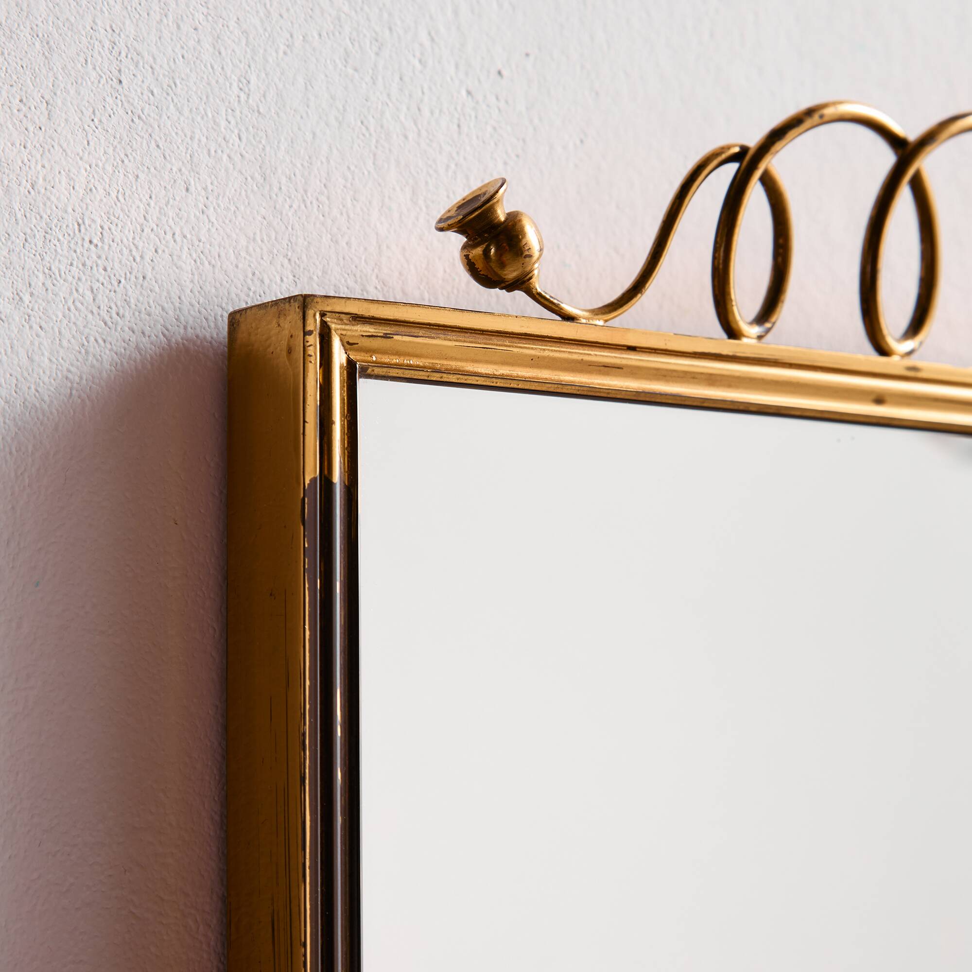 Metal and brass framed mirror