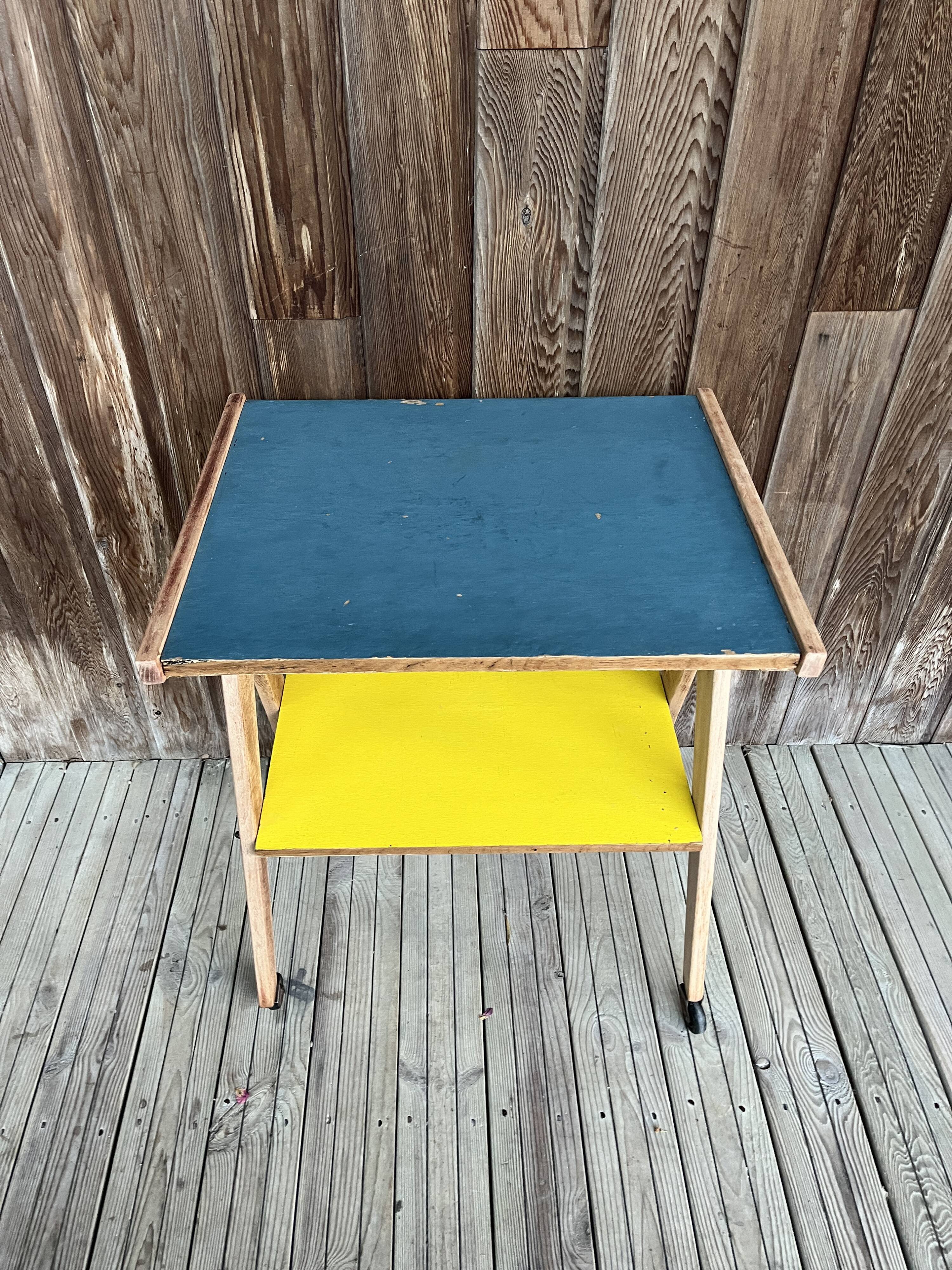 Yellow and blue serving trolley with compass base, 1950s