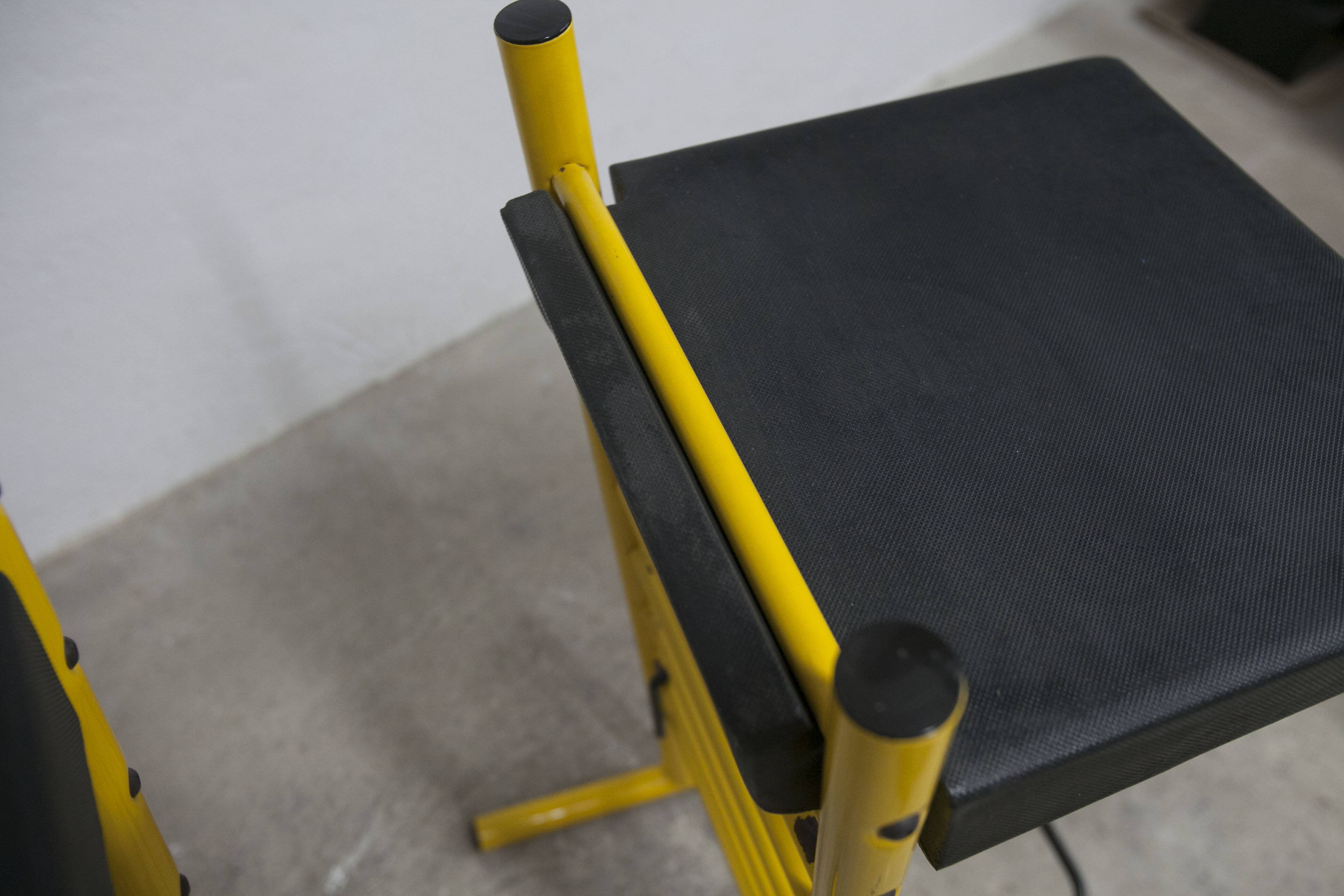 Pair of adjustable Italian bar stools in lacquered yellow and black