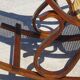 Vintage wooden rocking chair with caning