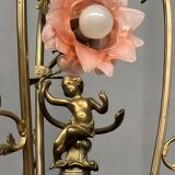 Renaissance chandelier with putti statuette.