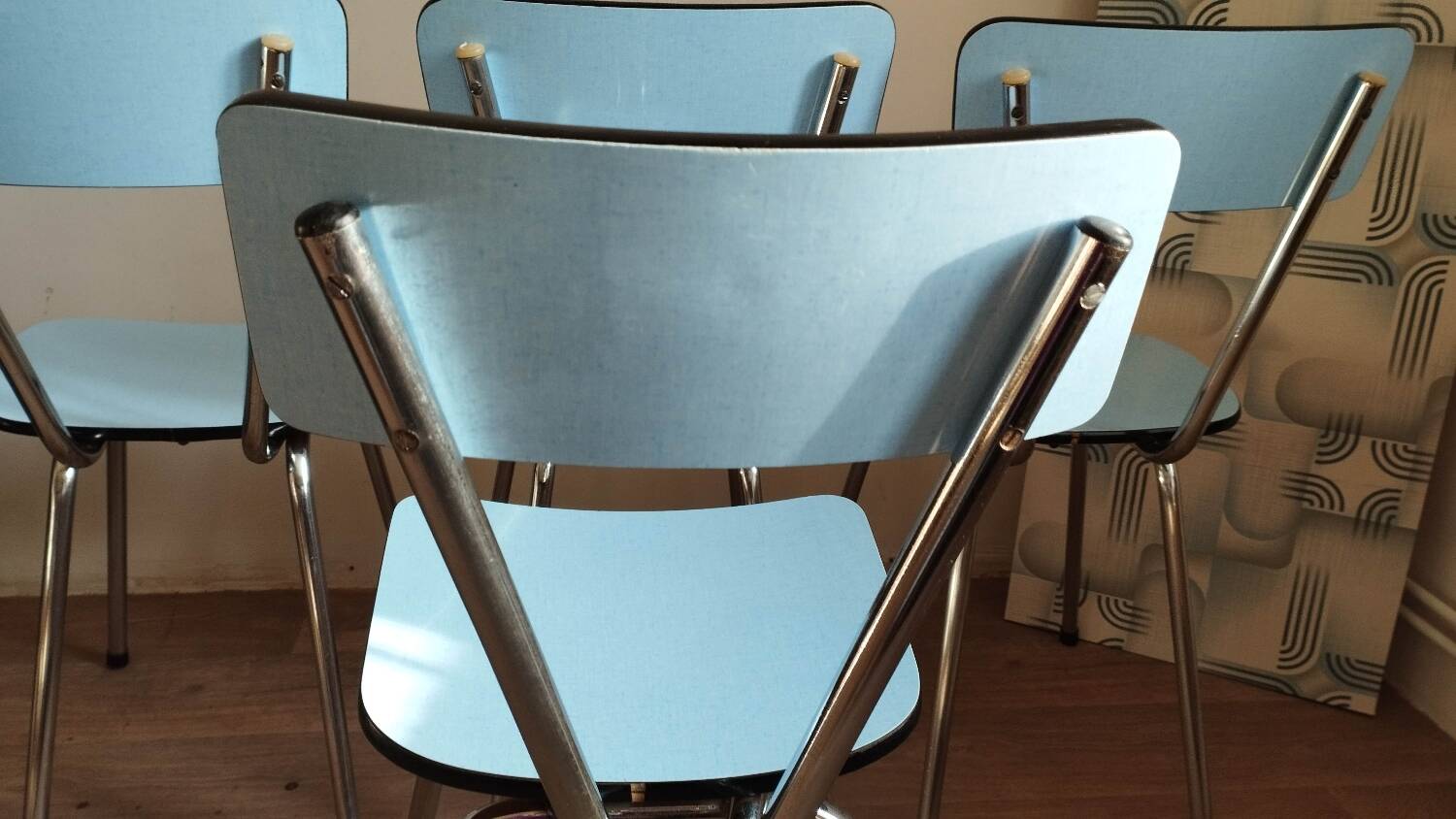 4 blue Formica chairs