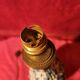Antique ceramic lamp with brass or bronze base from the attic