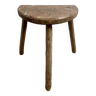 Cowherd tripod stool in old raw wood