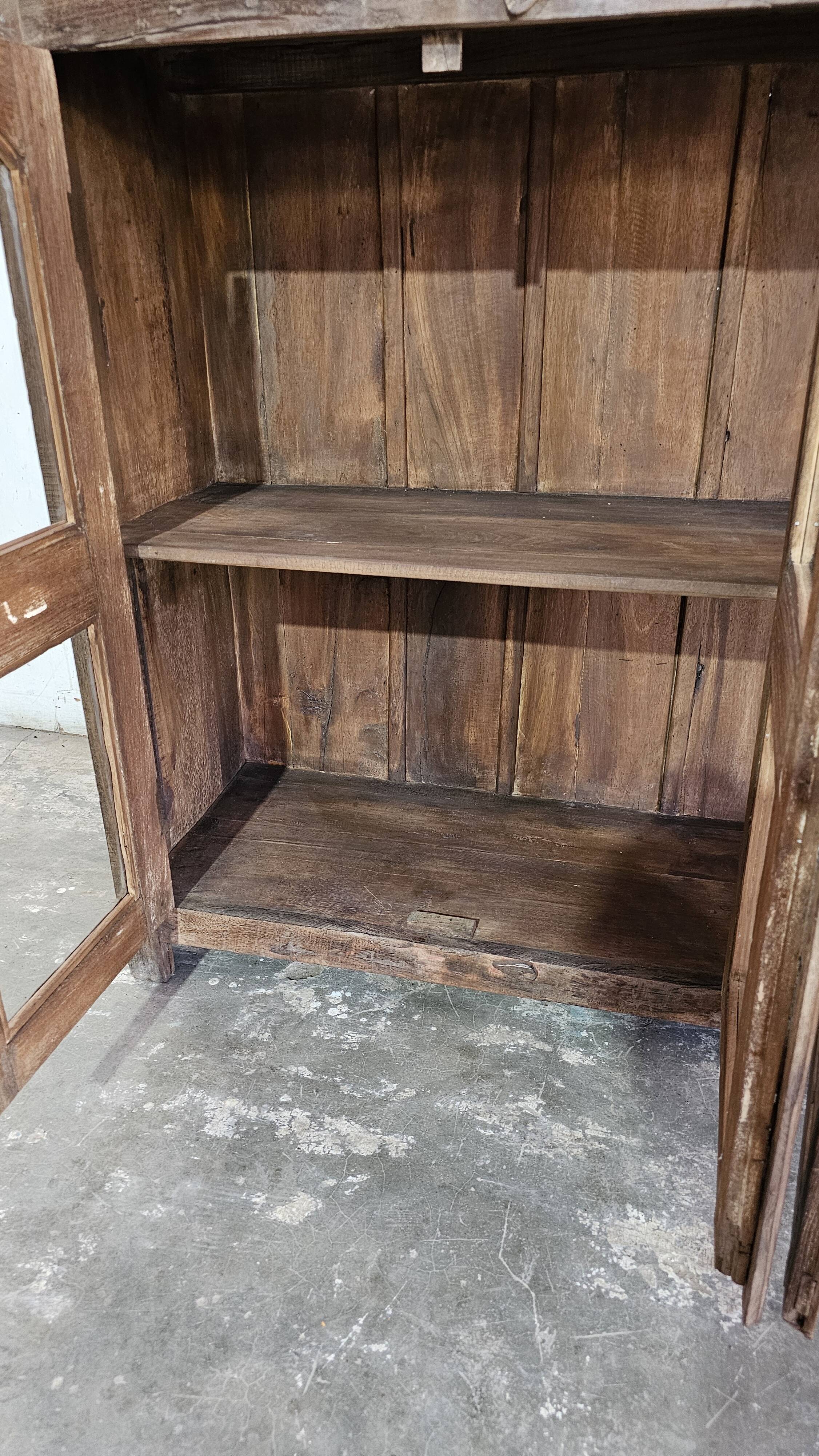 Antique glass-fronted buffet in Burmese teak