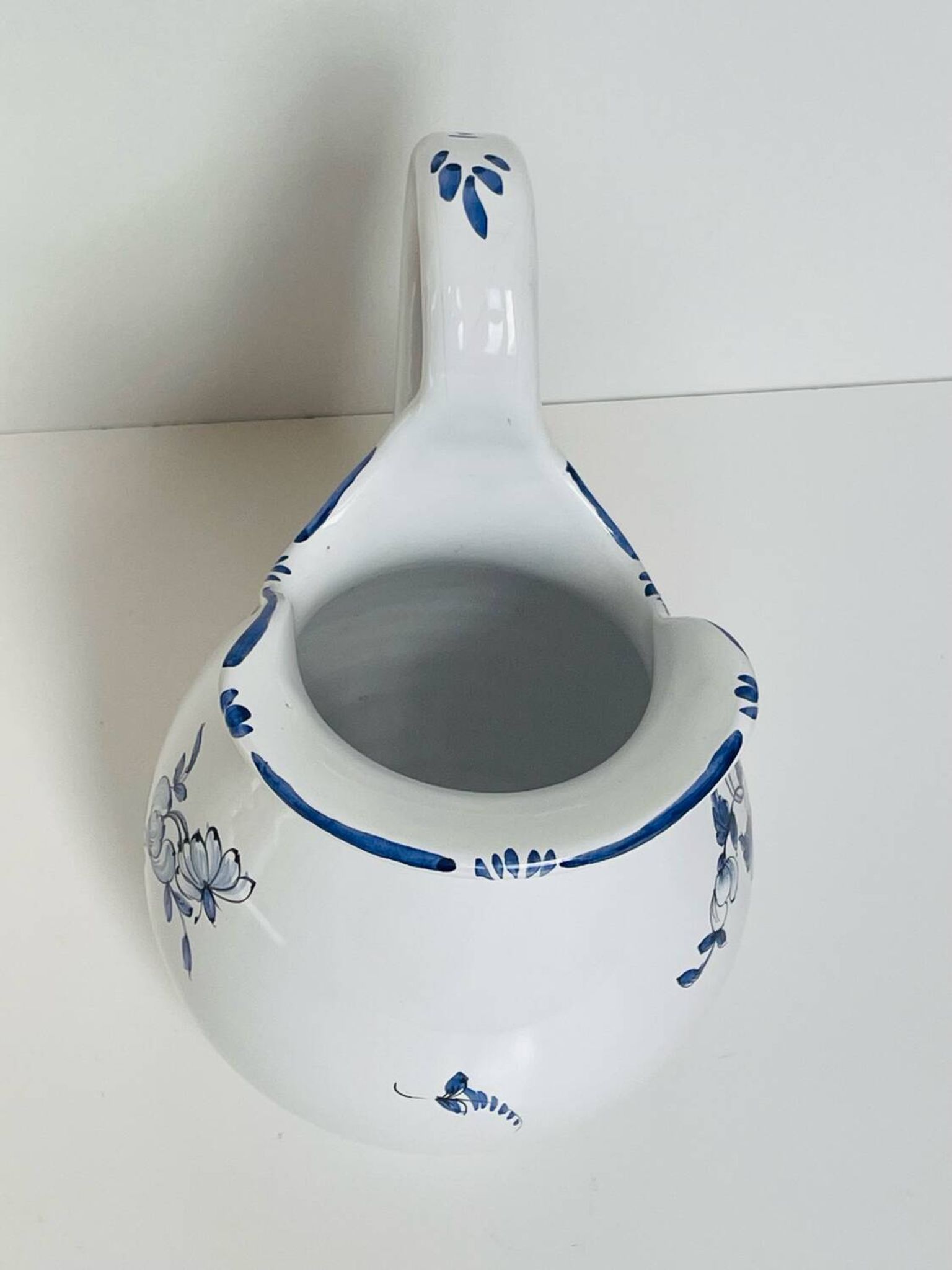Moustiers pitcher with blue floral decoration