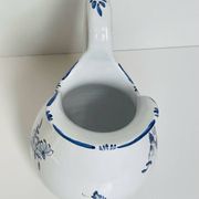 Moustiers pitcher with blue floral decoration